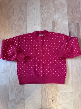 Red sweater with white hearts